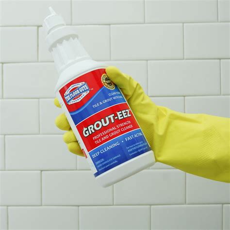 Allow it to stand for several minutes and agitate with a scrub brush, toothbrush or similar type tool. Apply additional solution if it begins to dry. Pick up excess solution with a mop or a wet-vacuum. Rinse the grout with plain warm water. Mix a solution of sulfamic acid with warm water per directions on the label.